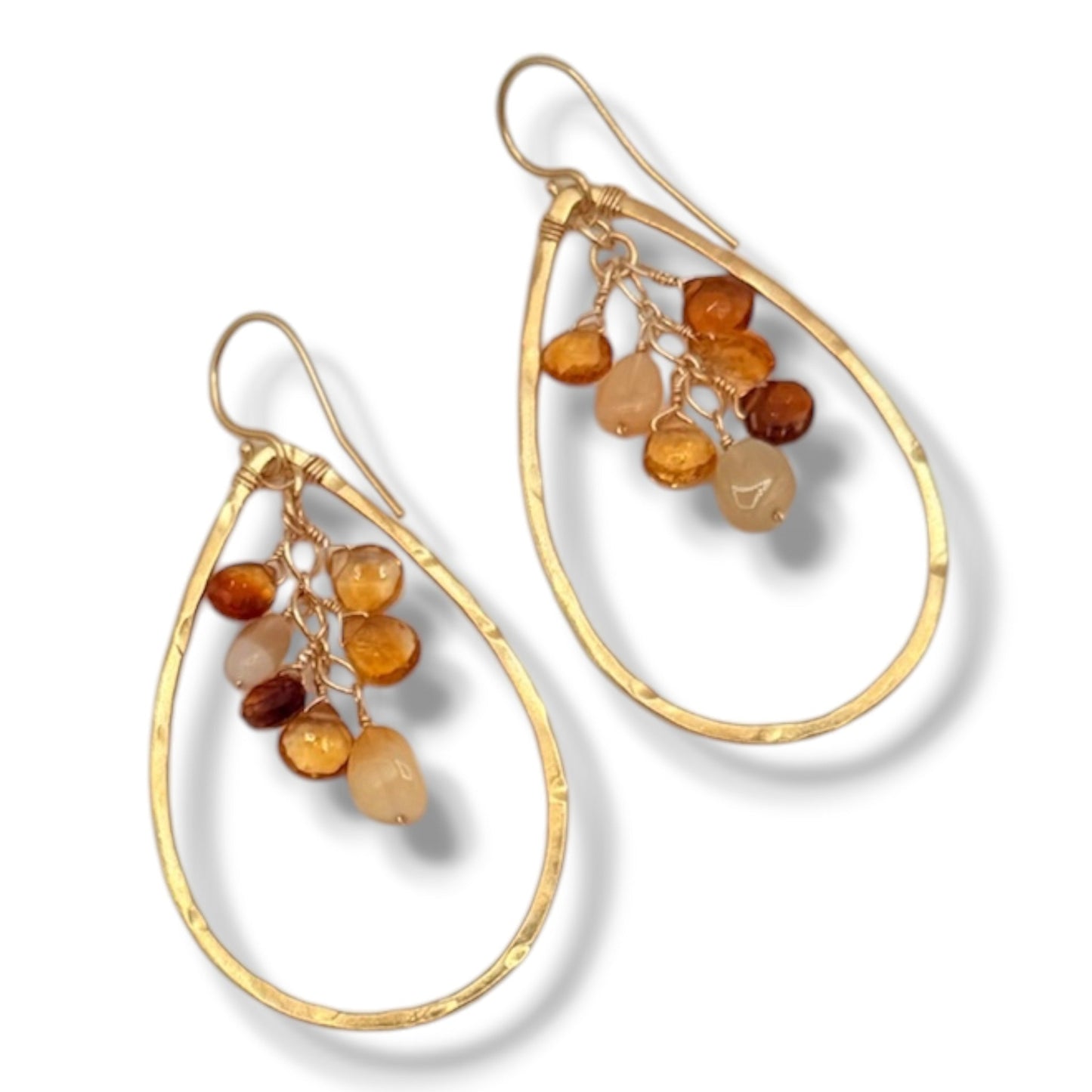 Pair of hammered gold vermeil hoop earrings with cascading opal, citrine, and brown garnet briolettes on flying lizard jewelry card