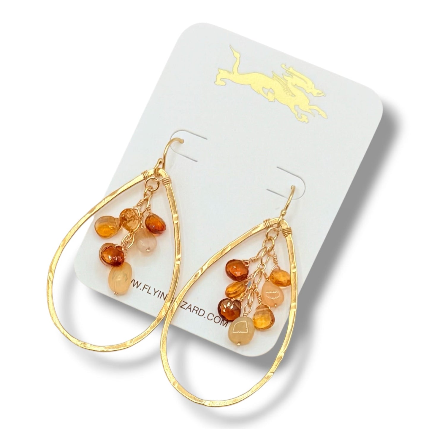 Close-up of gold vermeil hammered teardrop hoop earring with genuine opal, citrine, and brown garnet gemstones